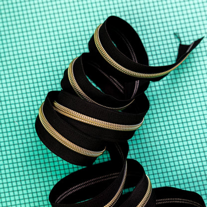 Sassafras Lane Black Zipper Tape with Faux Metal Nylon Teeth in Gold Finish